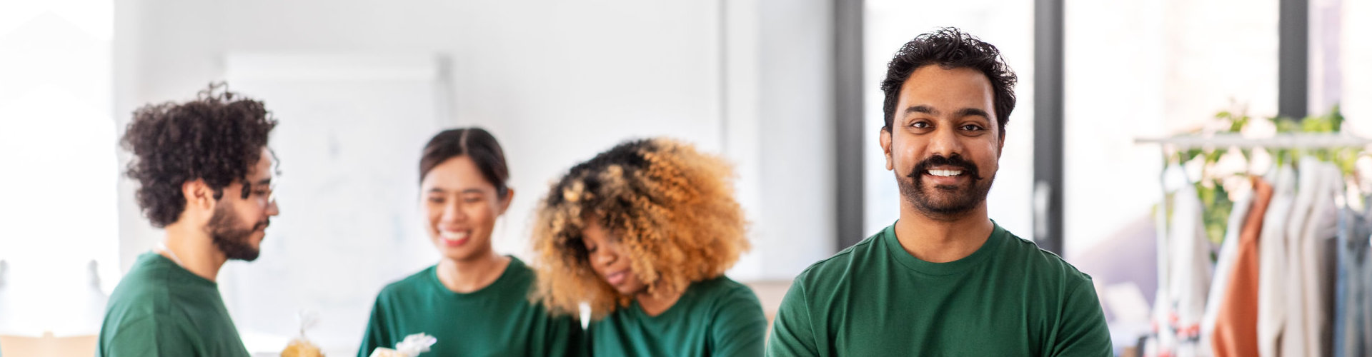 group of people in green shirt