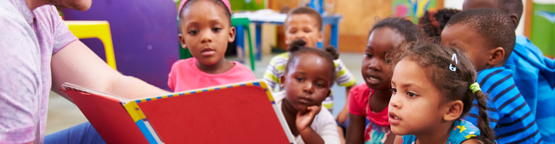 children looking at the book