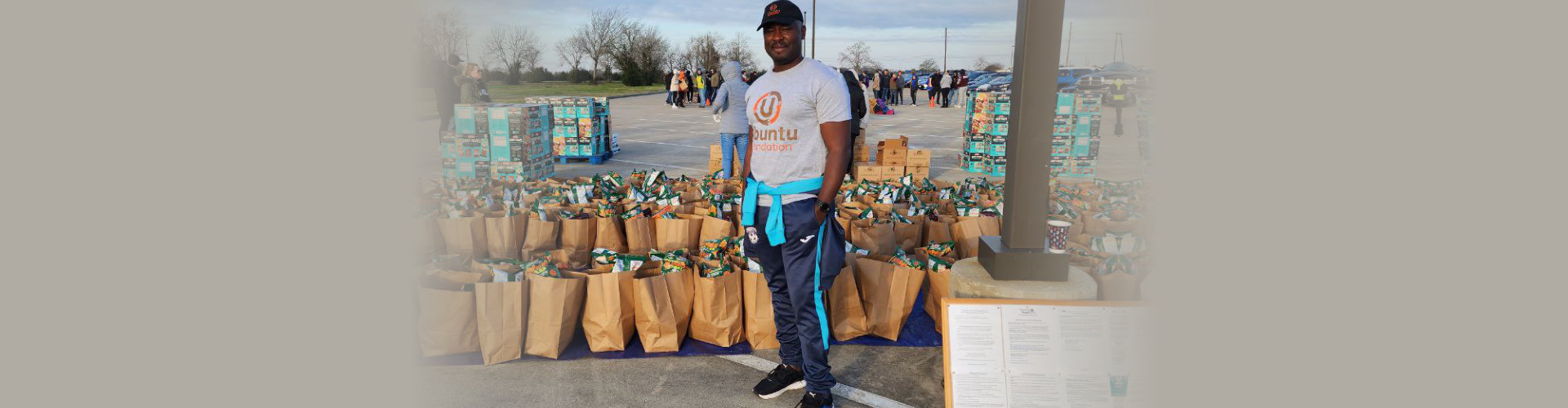 a man smiling with packed goods in his back